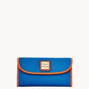 Dooney and Bourke Pebble Grain Continental Clutch. 6oz, color “jeans”